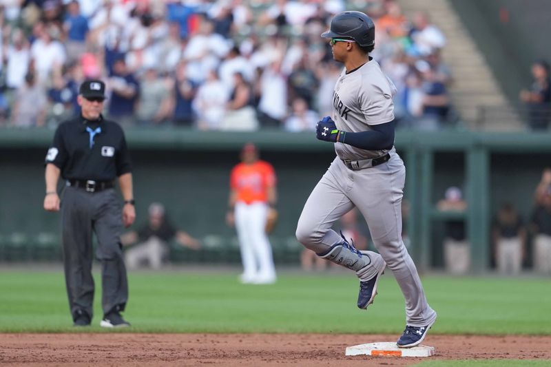 Jul 13, 2024; Baltimore, Maryland, USA; New York Yankees outfielder Juan Soto (22) rounds the bases following his solo home run in the fifth inning against the Baltimore Orioles at Oriole Park at Camden Yards. Mandatory Credit: Mitch Stringer-USA TODAY Sports