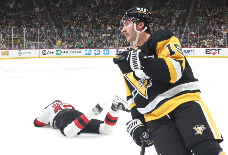 Mar 15, 2025; Pittsburgh, Pennsylvania, USA;  Pittsburgh Penguins center Connor Dewar (19) reacts fter scoring his second goal of the game against the New Jersey Devils during the third period at PPG Paints Arena. Mandatory Credit: Charles LeClaire-Imagn Images