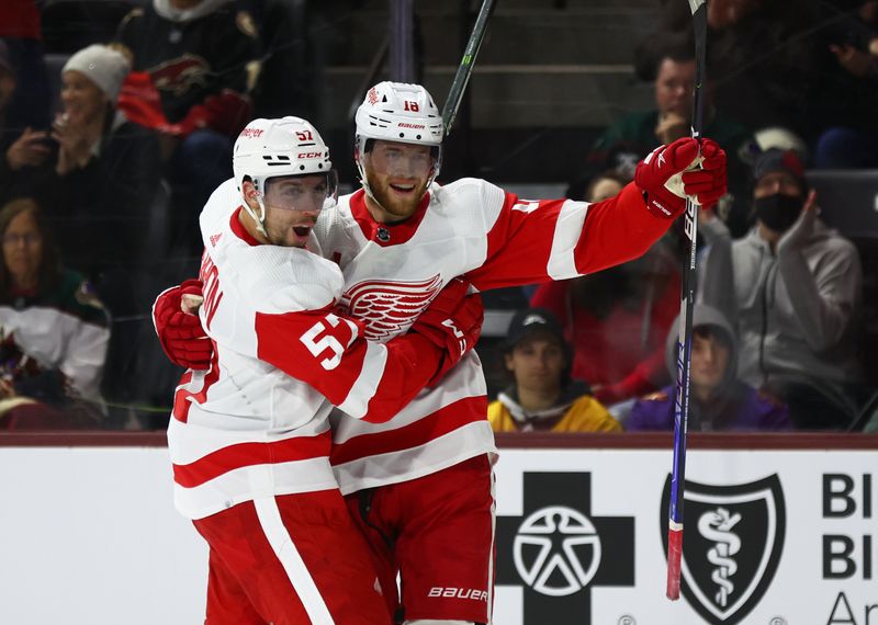 Jan 17, 2023; Tempe, Arizona, USA; Detroit Red Wings left wing David Perron (57) celebrates a goal with center Andrew Copp (18) against the Arizona Coyotes in the third period at Mullett Arena. Mandatory Credit: Mark J. Rebilas-USA TODAY Sports