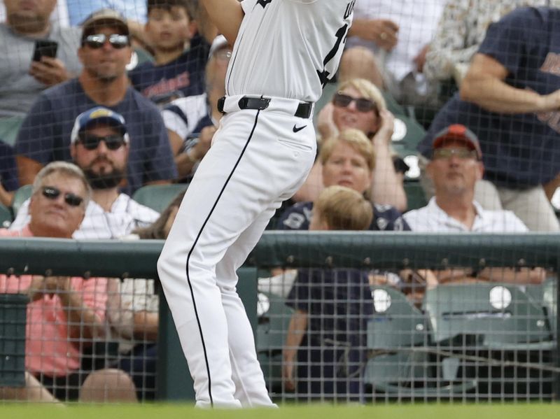 Jul 30, 2024; Detroit, Michigan, USA;  Detroit Tigers third baseman Gio Urshela (13) makes a catch against the Cleveland Guardians in the fourth inning at Comerica Park. Mandatory Credit: Rick Osentoski-USA TODAY Sports