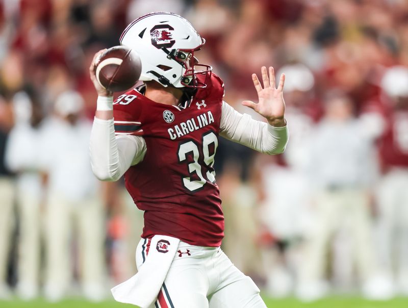 Sep 23, 2023; Columbia, South Carolina, USA; South Carolina Gamecocks punter Kai Kroeger (39) attempts a pass on a fake extra point attempt against the Mississippi State Bulldogs in the second quarter at Williams-Brice Stadium. Mandatory Credit: Jeff Blake-USA TODAY Sports