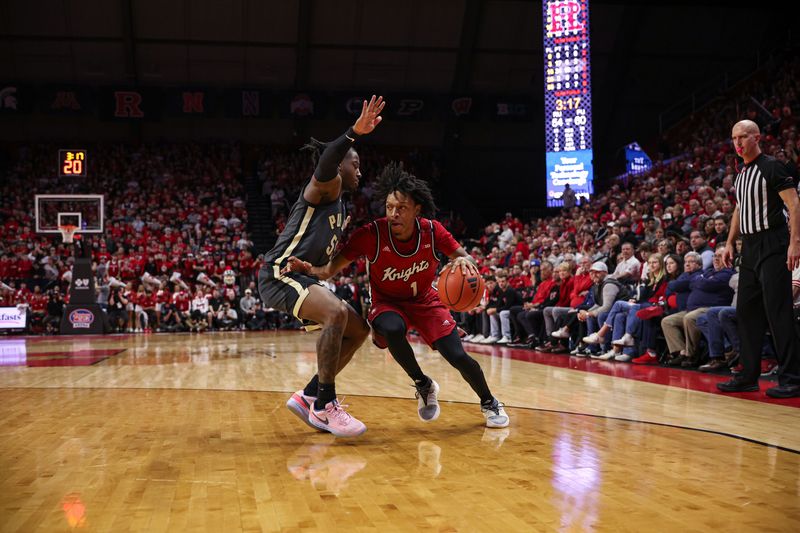 Jan 28, 2024; Piscataway, New Jersey, USA; Purdue Boilermakers forward Caleb Furst (1) dribbles against Purdue Boilermakers guard Lance Jones (55) during the second half at Jersey Mike's Arena. Mandatory Credit: Vincent Carchietta-USA TODAY Sports