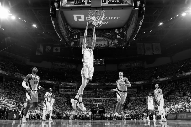 OKLAHOMA CITY, OK - JUNE 5:(EDITORS NOTE: This image has been converted to black and white) Chet Holmgren #7 of the Oklahoma City Thunder dunks the ball during the game against the Indiana Pacers during Game One of the 2025 NBA Finals on June 5, 2025 at Paycom Center in Oklahoma City, Oklahoma. NOTE TO USER: User expressly acknowledges and agrees that, by downloading and or using this photograph, User is consenting to the terms and conditions of the Getty Images License Agreement. Mandatory Copyright Notice: Copyright 2025 NBAE(Photo by Nathaniel S. Butler/NBAE via Getty Images)