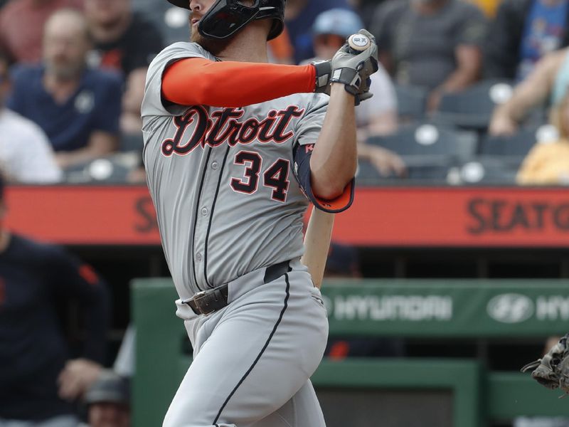 Apr 9, 2024; Pittsburgh, Pennsylvania, USA;  Detroit Tigers designated hitter Jake Rogers (34) hits an RBI single against the Pittsburgh Pirates during the ninth inning at PNC Park. Detroit won 5-3. Mandatory Credit: Charles LeClaire-USA TODAY Sports