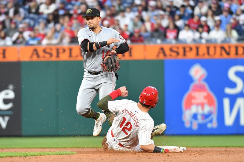 May 19, 2024; Philadelphia, Pennsylvania, USA; Washington Nationals second base Ildemaro Vargas (14) completes double play after getting force out on Philadelphia Phillies designated hitter Kyle Schwarber (12) during the sixth inning at Citizens Bank Park. Mandatory Credit: Eric Hartline-USA TODAY Sports