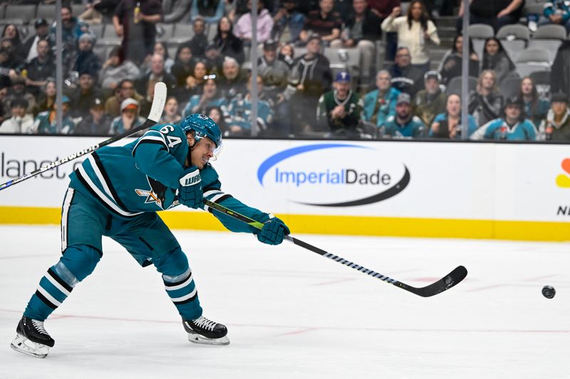 Oct 29, 2024; San Jose, California, USA; San Jose Sharks center Mikael Granlund (64) takes a shot on goal against the Los Angeles Kings in the second period at SAP Center at San Jose. Mandatory Credit: Eakin Howard-Imagn Images