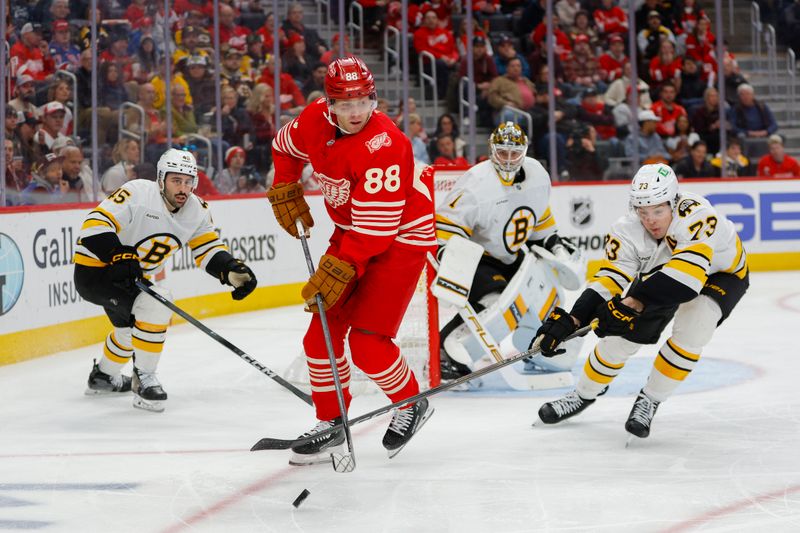 Mar 21, 2026; Detroit, Michigan, USA; Detroit Red Wings right wing Patrick Kane (88) handles the puck against Boston Bruins defenseman Charlie McAvoy (73) during the second period at Little Caesars Arena. Mandatory Credit: Brian Bradshaw Sevald-Imagn Images