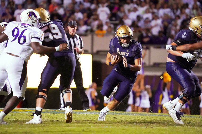 Sep 24, 2022; Greenville, North Carolina, USA; Navy Midshipmen quarterback Tai Lavatai (1) runs with the ball against the East Carolina Pirates during the second half  at Dowdy-Ficklen Stadium. Mandatory Credit: James Guillory-USA TODAY Sports