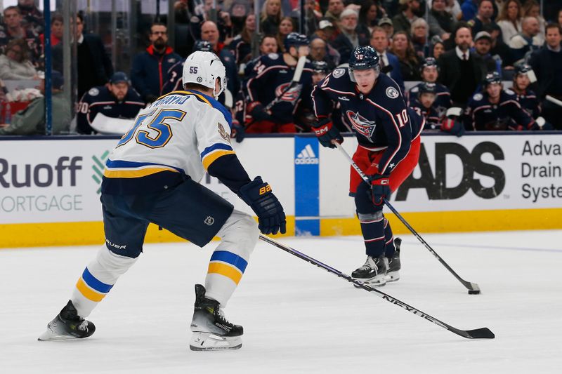 Dec 8, 2023; Columbus, Ohio, USA; Columbus Blue Jackets left wing Dmitri Voronkov (10) looks to shoot as St. Louis Blues defenseman Colton Parayko (55) defends during the second period at Nationwide Arena. Mandatory Credit: Russell LaBounty-USA TODAY Sports