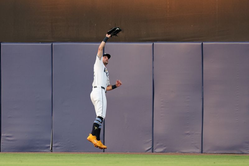 May 26, 2025; Tampa, Florida, USA; Tampa Bay Rays center fielder Kameron Misner (26) makes a catch in the outfield against the Minnesota Twins in the fifth inning at George M. Steinbrenner Field. Mandatory Credit: Nathan Ray Seebeck-Imagn Images