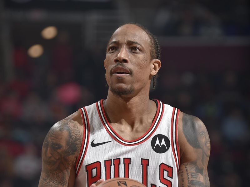 CLEVELAND, OH - FEBRUARY 14: DeMar DeRozan #11 of the Chicago Bulls prepares to shoot a free throw during the game against the Cleveland Cavaliers on February 14, 2024 at Rocket Mortgage FieldHouse in Cleveland, Ohio. NOTE TO USER: User expressly acknowledges and agrees that, by downloading and/or using this Photograph, user is consenting to the terms and conditions of the Getty Images License Agreement. Mandatory Copyright Notice: Copyright 2024 NBAE (Photo by David Liam Kyle/NBAE via Getty Images)