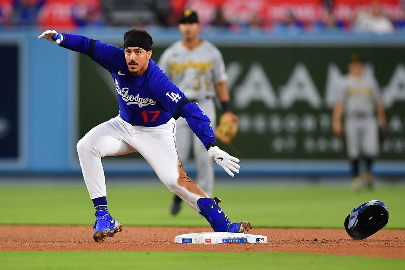 Jul 6, 2023; Los Angeles, California, USA; Los Angeles Dodgers second baseman Miguel Vargas (17) reaches second on a double against the Pittsburgh Pirates during the fifth inning at Dodger Stadium. Mandatory Credit: Gary A. Vasquez-USA TODAY Sports