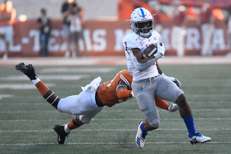 Oct 19, 2019; Austin, TX, USA; Kansas Jayhawks running back Pooka Williams Jr. (1) runs for yardage against the Texas Longhorns in the first half at Darrell K Royal-Texas Memorial Stadium. Mandatory Credit: Scott Wachter-USA TODAY Sports