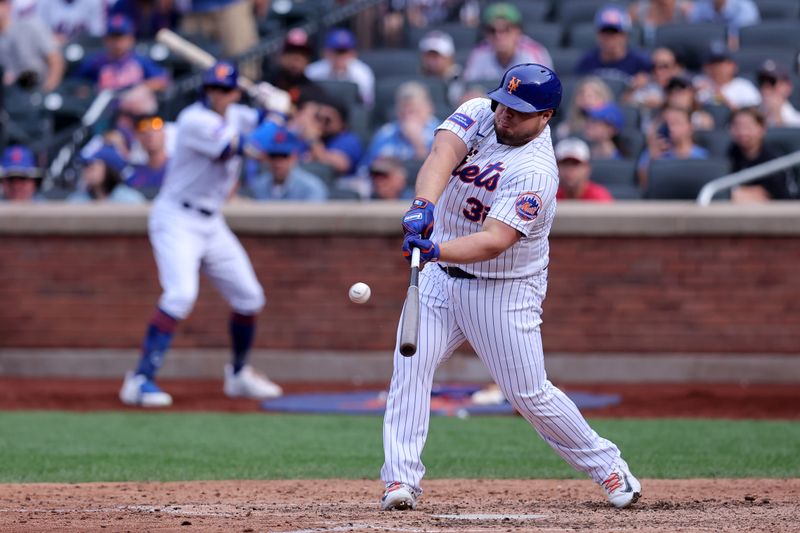 Sep 17, 2023; New York City, New York, USA; New York Mets pinch hitter Daniel Vogelbach (32) hits a three run double against the Cincinnati Reds during the seventh inning at Citi Field. Mandatory Credit: Brad Penner-USA TODAY Sports