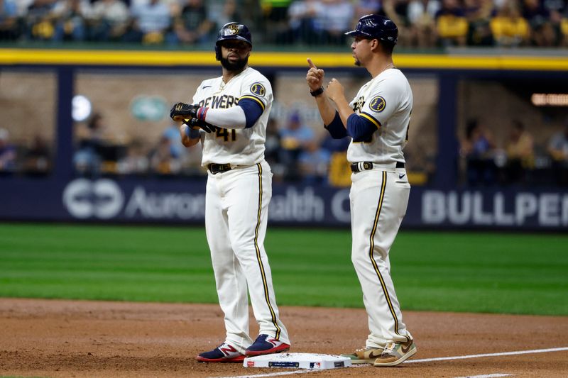 Oct 4, 2023; Milwaukee, Wisconsin, USA; Milwaukee Brewers first baseman Carlos Santana (41) reacts after walking to first in in the first inning against the Arizona Diamondbacks during game two of the Wildcard series for the 2023 MLB playoffs at American Family Field. Mandatory Credit: Kamil Krzaczynski-USA TODAY Sports