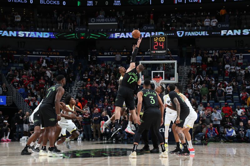 NEW ORLEANS, LA - JANUARY 23: Kris Dunn #11 of the Utah Jazz and Jonas Valanciunas #17 of the New Orleans Pelicans go up for a jump ball on January 23, 2024 at the Smoothie King Center in New Orleans, Louisiana. NOTE TO USER: User expressly acknowledges and agrees that, by downloading and or using this Photograph, user is consenting to the terms and conditions of the Getty Images License Agreement. Mandatory Copyright Notice: Copyright 2024 NBAE (Photo by Layne Murdoch Jr./NBAE via Getty Images)