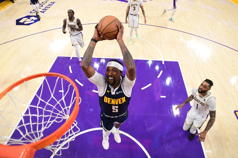 LOS ANGELES, CA - APRIL 27: Kentavious Caldwell-Pope #5 of the Denver Nuggets drives to the basket during the games against the Los Angeles Lakers during Round 1 Game 4 of the 2024 NBA Playoffs on April 27, 2024 at Crypto.Com Arena in Los Angeles, California. NOTE TO USER: User expressly acknowledges and agrees that, by downloading and/or using this Photograph, user is consenting to the terms and conditions of the Getty Images License Agreement. Mandatory Copyright Notice: Copyright 2024 NBAE (Photo by Adam Pantozzi/NBAE via Getty Images)