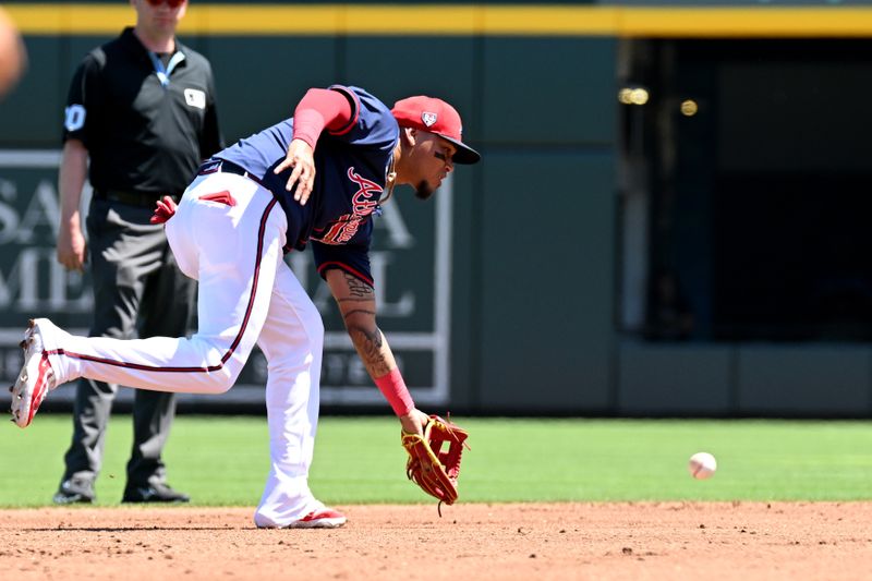 Mar 20, 2024; North Port, Florida, USA; Atlanta Braves shortstop Orlando Arcia (11) fields a ground ball in the second inning of a spring training game against the Toronto Blue Jays  at CoolToday Park. Mandatory Credit: Jonathan Dyer-USA TODAY Sports