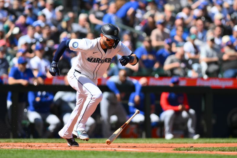 Apr 14, 2024; Seattle, Washington, USA; Seattle Mariners right fielder Mitch Haniger (17) runs towards first base after hitting a single against the Chicago Cubs during the fourth inning at T-Mobile Park. Mandatory Credit: Steven Bisig-USA TODAY Sports