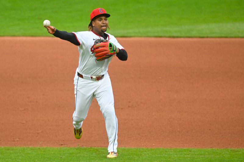 Apr 30, 2025; Cleveland, Ohio, USA; Cleveland Guardians third baseman Jose Ramirez (11) throws to first base in the fourth inning against the Minnesota Twins at Progressive Field. Mandatory Credit: David Richard-Imagn Images