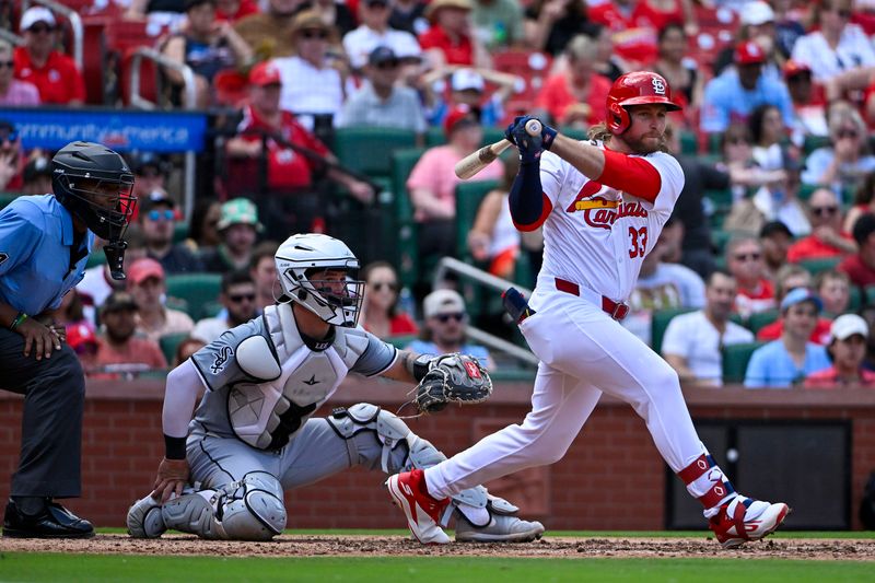 May 4, 2024; St. Louis, Missouri, USA;  St. Louis Cardinals left fielder Brendan Donovan (33) hits a two run double against the Chicago White Sox during the fifth inning at Busch Stadium. Mandatory Credit: Jeff Curry-USA TODAY Sports