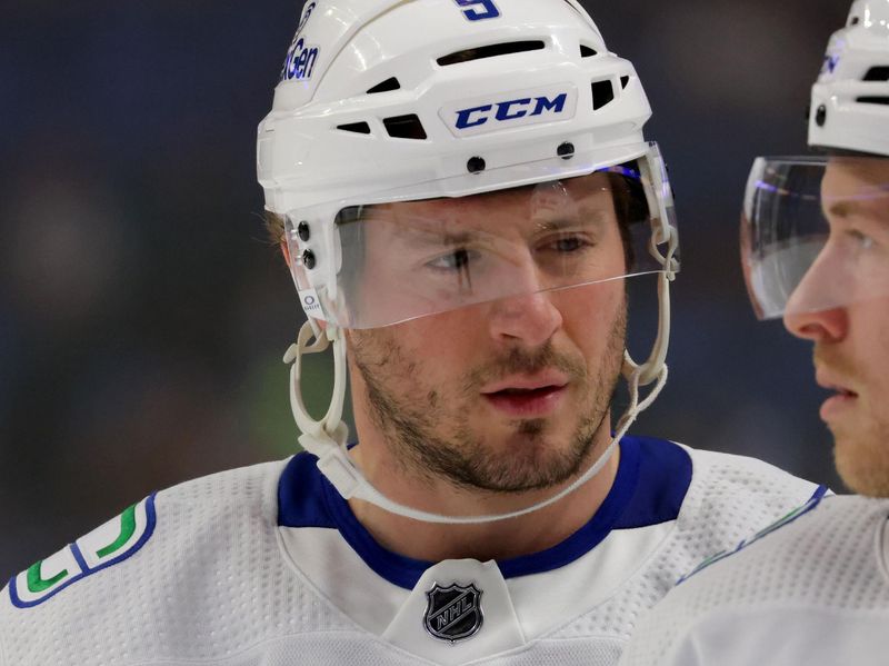 Jan 13, 2024; Buffalo, New York, USA;  Vancouver Canucks center J.T. Miller (9) during a stoppage in play against the Buffalo Sabres during the first period at KeyBank Center. Mandatory Credit: Timothy T. Ludwig-USA TODAY Sports