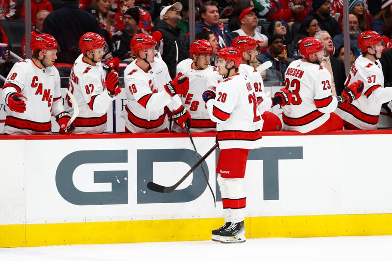 Mar 22, 2024; Washington, District of Columbia, USA; Carolina Hurricanes center Sebastian Aho (20) celebrates with teammates on the bench after scoring a goal against the Washington Capitals during the first period at Capital One Arena. Mandatory Credit: Amber Searls-USA TODAY Sports