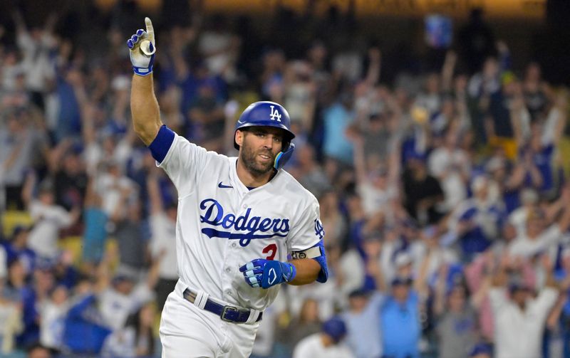 Sep 24, 2023; Los Angeles, California, USA;  Los Angeles Dodgers shortstop Chris Taylor (3) celebrates after hitting a walk-off RBI single to defeat the San Francisco Giants in the tenth inning at Dodger Stadium. Mandatory Credit: Jayne Kamin-Oncea-USA TODAY Sports