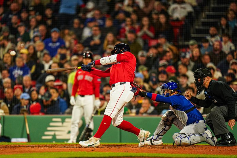 Apr 26, 2024; Boston, Massachusetts, USA; Boston Red Sox right fielder Tyler O'Neill (17) hits a home run against the Chicago Cubs in the forth inning at Fenway Park. Mandatory Credit: David Butler II-USA TODAY Sports