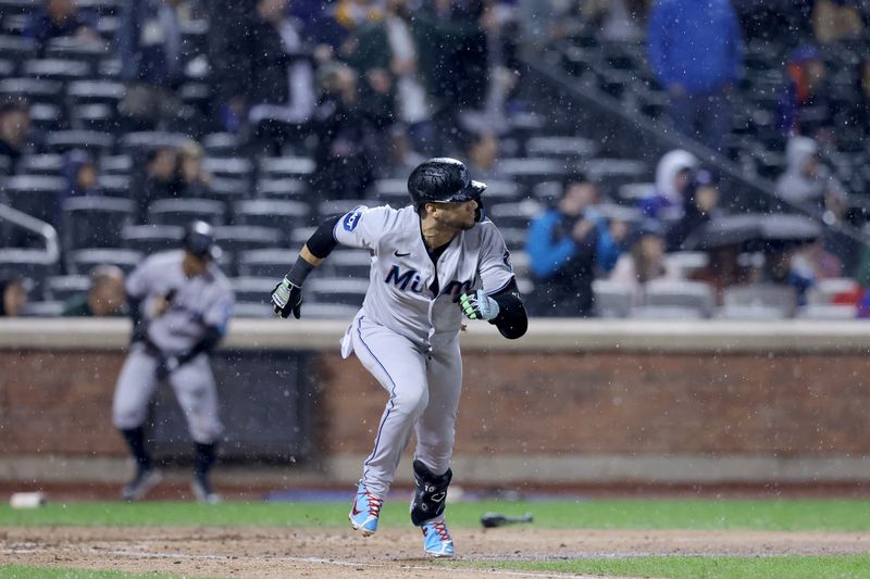 Sep 28, 2023; New York City, New York, USA; Miami Marlins pinch hitter Yuli Gurriel (10) runs out an RBI single against the New York Mets during the ninth inning at Citi Field. Mandatory Credit: Brad Penner-USA TODAY Sports