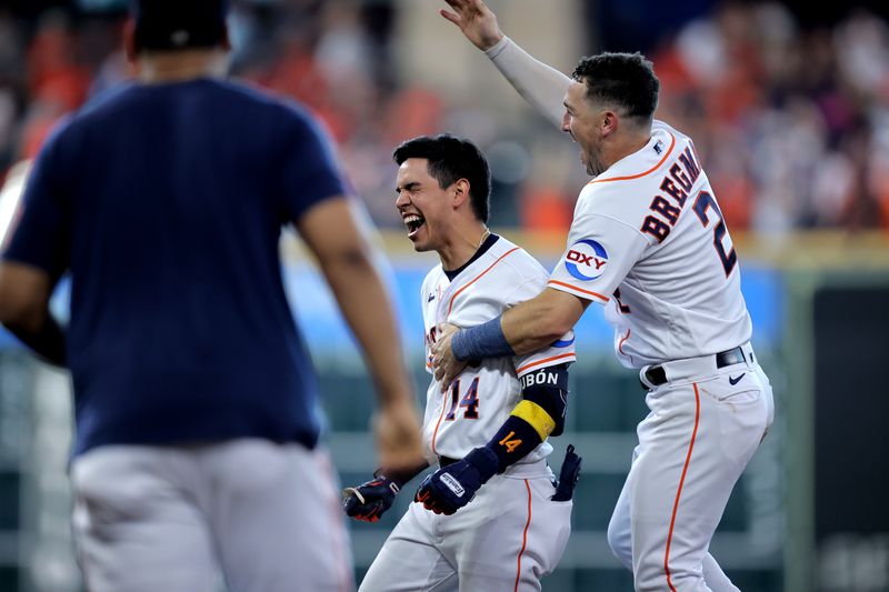 Sep 20, 2023; Houston, Texas, USA; Houston Astros center fielder Mauricio Dubon (14) celebrates with Houston Astros third baseman Alex Bregman (2) after hitting a walk off single against the Baltimore Orioles during the ninth inning at Minute Maid Park. Mandatory Credit: Erik Williams-USA TODAY Sports