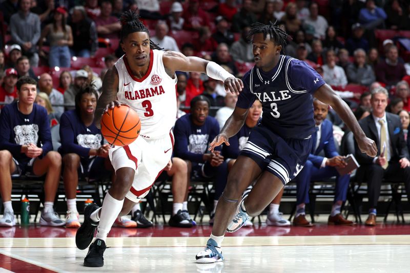 Dec 29, 2025; Tuscaloosa, Alabama, USA; Alabama Crimson Tide guard Latrell Wrightsell Jr. (3) dribbles against Yale Bulldogs guard Jordan Brathwaite (3) during the first half at Coleman Coliseum. Mandatory Credit: David Leong-Imagn Images