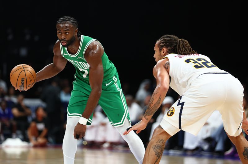 ABU DHABI, UNITED ARAB EMIRATES - OCTOBER 04: Jaylen Brown of Boston Celtics dribbles the ball during the NBA match between Denver Nuggets and Boston Celtics at Etihad Arena on October 04, 2024 in Abu Dhabi, United Arab Emirates.  (Photo by Francois Nel/Getty Images)