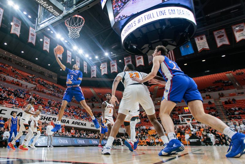 Jan 16, 2024; Stillwater, Oklahoma, USA; Kansas Jayhawks guard Dajuan Harris Jr. (3) puts up a shot during the second half against the Oklahoma State Cowboys at Gallagher-Iba Arena. Mandatory Credit: William Purnell-USA TODAY Sports