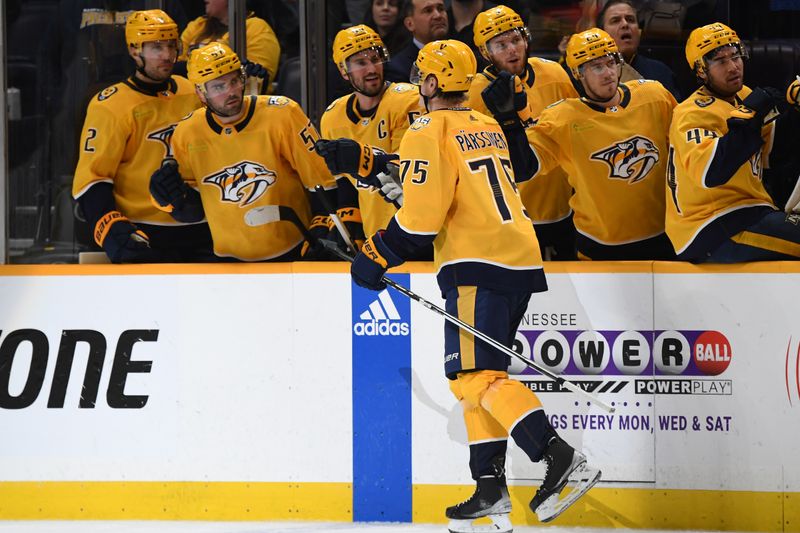 Dec 3, 2023; Nashville, Tennessee, USA; Nashville Predators center Juuso Parssinen (75) is congratulated by teammates after a goal during the first period against the Tampa Bay Lightning at Bridgestone Arena. Mandatory Credit: Christopher Hanewinckel-USA TODAY Sports