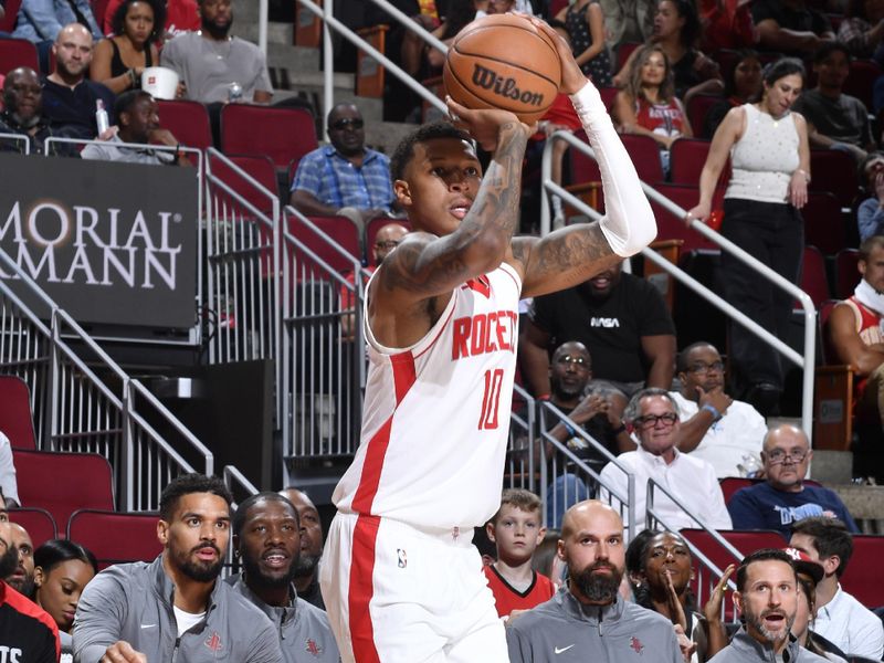 HOUSTON, TX - OCTOBER 15: Jabari Smith Jr. #10 of the Houston Rockets shoots a three point basket during the game against the New Orleans Pelicans during a NBA preseason game on October 15, 2024 at the Toyota Center in Houston, Texas. NOTE TO USER: User expressly acknowledges and agrees that, by downloading and or using this photograph, User is consenting to the terms and conditions of the Getty Images License Agreement. Mandatory Copyright Notice: Copyright 2024 NBAE (Photo by Logan Riely/NBAE via Getty Images)