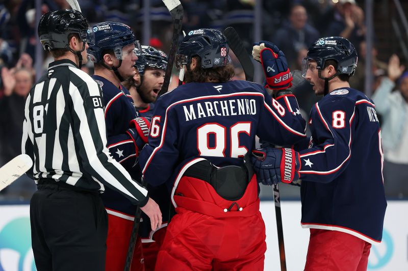Dec 11, 2025; Columbus, Ohio, USA;  Columbus Blue Jackets right wing Kirill Marchenko (86) and Jackets defenseman Zach Werenski (8) celebrate a goal during the second period against the Ottawa Senators at Nationwide Arena. Mandatory Credit: Joseph Maiorana-Imagn Images