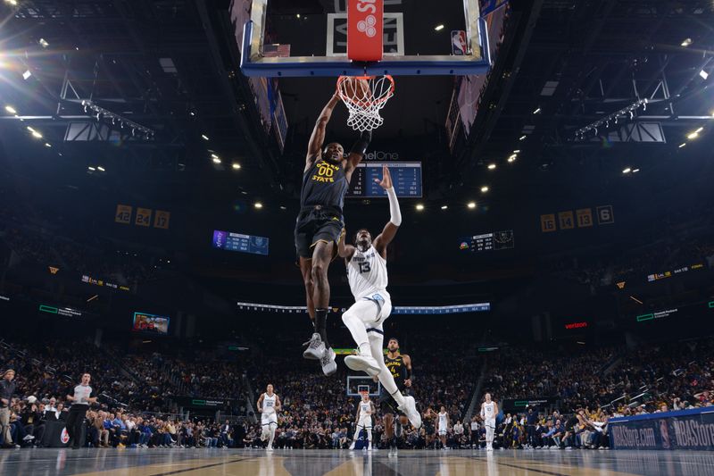 SAN FRANCISCO, CA - NOVEMBER 15: Jonathan Kuminga #00 of the Golden State Warriors dunks the ball during the game against the Memphis Grizzlies during the Emirates NBA Cup game on November 15, 2024 at Chase Center in San Francisco, California. NOTE TO USER: User expressly acknowledges and agrees that, by downloading and or using this photograph, user is consenting to the terms and conditions of Getty Images License Agreement. Mandatory Copyright Notice: Copyright 2024 NBAE (Photo by Noah Graham/NBAE via Getty Images)