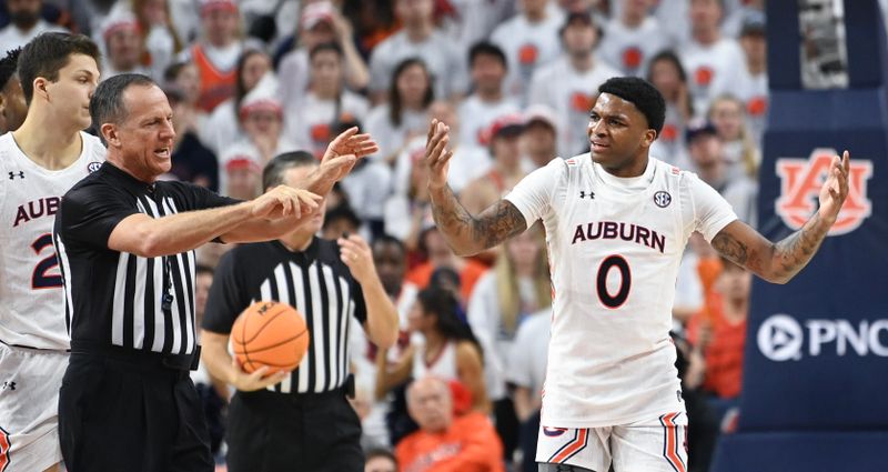 Feb 11, 2023; Auburn, Alabama, USA;  Auburn Tigers guard K.D. Johnson (0) questions a call in favor of the Alabama Crimson Tide at Neville Arena. Mandatory Credit: Julie Bennett-USA TODAY Sports