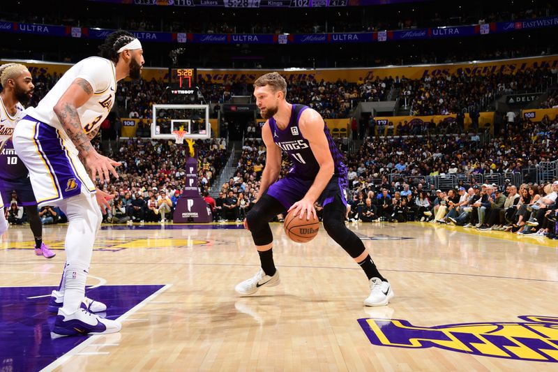 LOS ANGELES, CA - OCTOBER 26: Domantas Sabonis #11 of the Sacramento Kings dribbles the ball during the game against the Los Angeles Lakers on October 26, 2024 at Crypto.Com Arena in Los Angeles, California. NOTE TO USER: User expressly acknowledges and agrees that, by downloading and/or using this Photograph, user is consenting to the terms and conditions of the Getty Images License Agreement. Mandatory Copyright Notice: Copyright 2024 NBAE (Photo by Adam Pantozzi/NBAE via Getty Images)