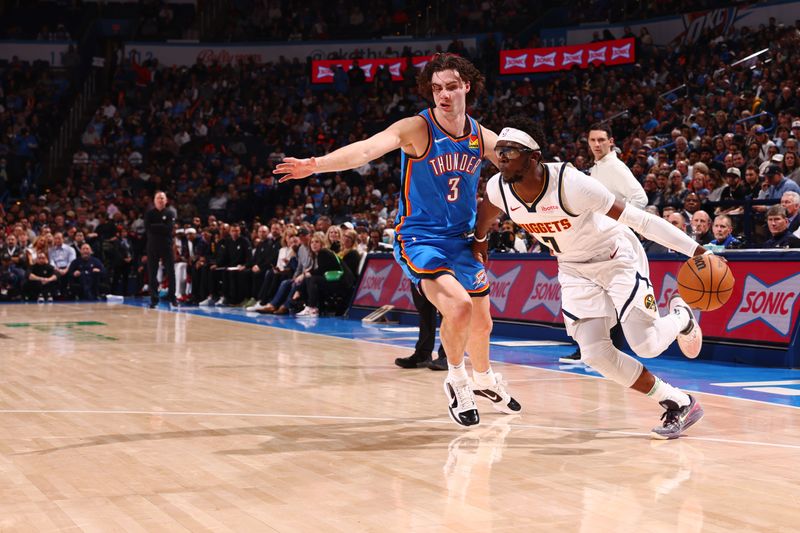 OKLAHOMA CITY, OK - JANUARY 31: Reggie Jackson #7 of the Denver Nuggets dribbles the ball during the game against the Oklahoma City Thunder on January 31, 2024 at Paycom Arena in Oklahoma City, Oklahoma. NOTE TO USER: User expressly acknowledges and agrees that, by downloading and or using this photograph, User is consenting to the terms and conditions of the Getty Images License Agreement. Mandatory Copyright Notice: Copyright 2024 NBAE (Photo by Zach Beeker/NBAE via Getty Images)