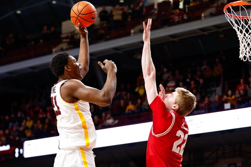 Jan 23, 2024; Minneapolis, Minnesota, USA; Minnesota Golden Gophers forward Pharrel Payne (21) shoots as Wisconsin Badgers forward Steven Crowl (22) defends during the first half at Williams Arena. Mandatory Credit: Matt Krohn-USA TODAY Sports