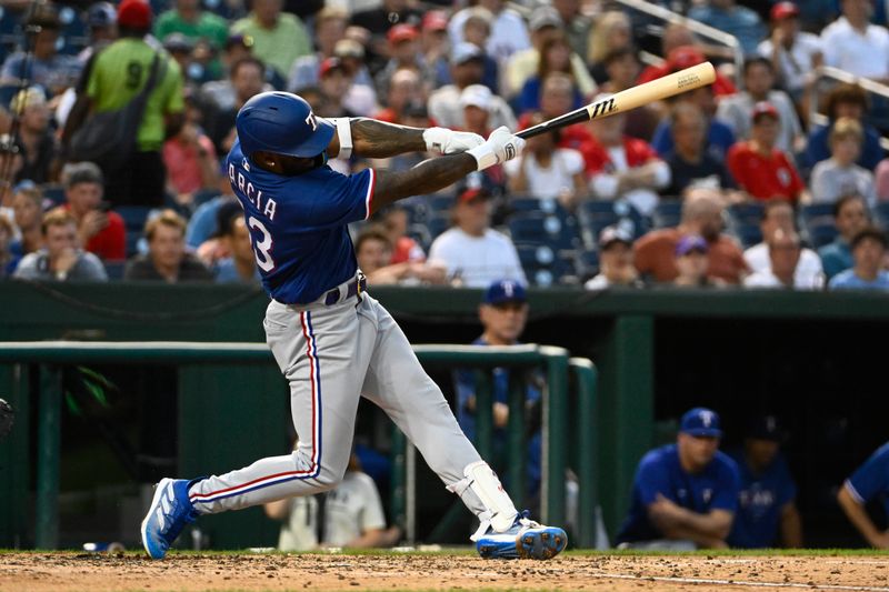 Jul 7, 2023; Washington, District of Columbia, USA; Texas Rangers right fielder Adolis Garcia (53) doubles against the Washington Nationals during the fifth inning at Nationals Park. Mandatory Credit: Brad Mills-USA TODAY Sports