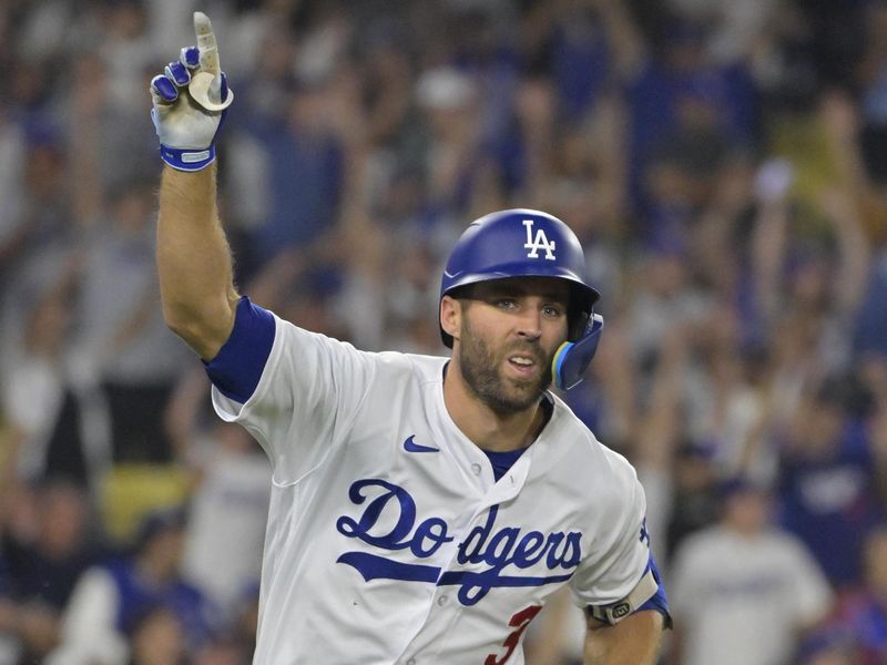 Sep 24, 2023; Los Angeles, California, USA;  Los Angeles Dodgers shortstop Chris Taylor (3) celebrates after hitting a walk-off RBI single to defeat the San Francisco Giants in the tenth inning at Dodger Stadium. Mandatory Credit: Jayne Kamin-Oncea-USA TODAY Sports