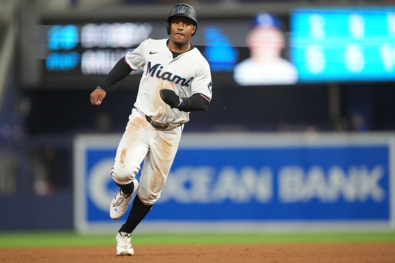 Sep 17, 2024; Miami, Florida, USA;  Miami Marlins shortstop Xavier Edwards (63) heads from first to third base on a base hit in the first inning against the Los Angeles Dodgers at loanDepot Park. Mandatory Credit: Jim Rassol-Imagn Images