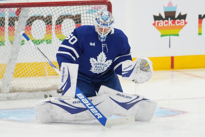 Nov 20, 2024; Toronto, Ontario, CAN; Toronto Maple Leafs goaltender Joseph Woll (60) makes a save during warm ups before a game against the Vegas Golden Knights at Scotiabank Arena. Mandatory Credit: John E. Sokolowski-Imagn Images