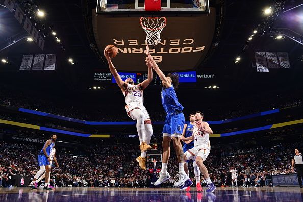 PHOENIX, AZ - DECEMBER 25: Eric Gordon #23 of the Phoenix Suns shoots the ball during the game against the Dallas Mavericks on December 25, 2023 at Footprint Center in Phoenix, Arizona. NOTE TO USER: User expressly acknowledges and agrees that, by downloading and or using this photograph, user is consenting to the terms and conditions of the Getty Images License Agreement. Mandatory Copyright Notice: Copyright 2023 NBAE (Photo by Barry Gossage/NBAE via Getty Images)