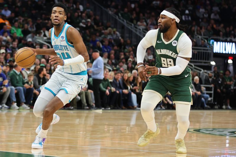 MILWAUKEE, WISCONSIN - FEBRUARY 09: Brandon Miller #24 of the Charlotte Hornets is defended by Jae Crowder #99 of the Milwaukee Bucks during a game at Fiserv Forum on February 09, 2024 in Milwaukee, Wisconsin. NOTE TO USER: User expressly acknowledges and agrees that, by downloading and or using this photograph, User is consenting to the terms and conditions of the Getty Images License Agreement. (Photo by Stacy Revere/Getty Images)