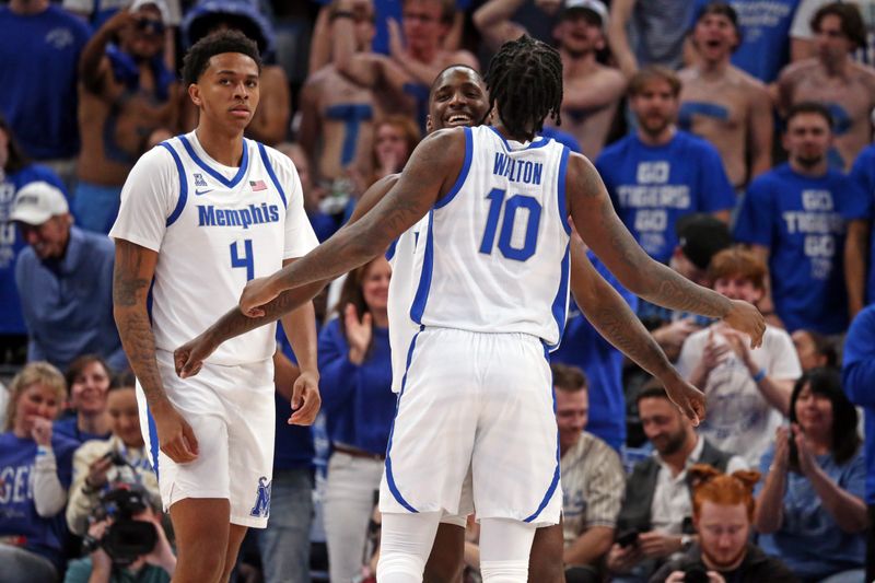 Feb 25, 2024; Memphis, Tennessee, USA; Memphis Tigers forward David Jones (8) reacts with Memphis Tigers guard Jaykwon Walton (10) during the second half against the Florida Atlantic Owls at FedExForum. Mandatory Credit: Petre Thomas-USA TODAY Sports