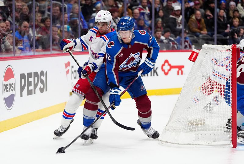 Jan 14, 2025; Denver, Colorado, USA; New York Rangers center Filip Chytil (72) and Colorado Avalanche defenseman Josh Manson (42) battle for the puck in the first period at Ball Arena. Mandatory Credit: Ron Chenoy-Imagn Images